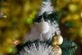 Magic cute Christmas toys and decorations on an artificial Christmas tree, beautiful holiday mood
