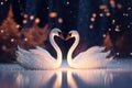 magic festive of a couple swan covered in glowing lights, in a wedding scene Royalty Free Stock Photo