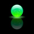 Magic glass green ball on black background