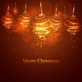 Magic golden Christmas tree balls on red background. Glowing spirals trace with shined dust Royalty Free Stock Photo