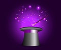 Magic hat with wand on violet mysterious background Royalty Free Stock Photo