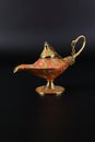 Magic lamp of Alladin on a dark and light background.