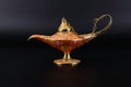 Magic lamp of Alladin on a dark and light background.