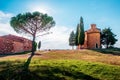Magic landscape with chapel of Madonna di Vitaleta on a sunny day in San Quirico d`Orcia Val d`Orcia in Tuscany, Italy. Royalty Free Stock Photo