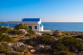 Magic landscape - small white church on the rocky shore of the c Royalty Free Stock Photo
