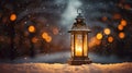 Magic lantern with candles in the snow against the background of night lights. Christmas atmosphere