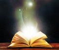 Magic light emanating from open old book Royalty Free Stock Photo