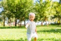Little nice child catching soap bubbles outside Royalty Free Stock Photo