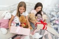 Magic moments. Small girls bed on Christmas eve. Happy children Christmas spirit. Small children in bedroom with gift