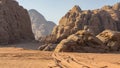 Magic mountain landscapes of Wadi Rum Desert, Jordan. Mountains in lifeless desert resemble Martian craters. Red sand and red rock Royalty Free Stock Photo