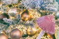 Magic pink mushroom and a lot of Christmas balls on the Christmas tree. Festive Christmas toys. New Year mood. Royalty Free Stock Photo