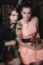 Magic portrait romantic beautiful couple of pretty girl with stylish hair, fashion make up, red lips, vintage dress