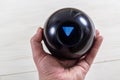 Magic prediction eight ball in hand Royalty Free Stock Photo