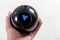 Magic prediction eight ball in hand Royalty Free Stock Photo