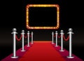 Magic red carpet loop with signboard with light bulbs on black background Royalty Free Stock Photo
