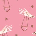 Magic seamless pattern. Woman's hand with a crystal on a chain and gold stars. Lithomancy. Mystical divination. Pink