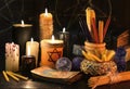 Magic still life with candles, books and the tarot cards