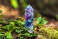 Magic still life with Gemstones fluorite crystal on nature background. Rocks for mystic ritual, witchcraft Wiccan or spiritual