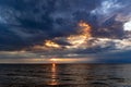 Magic sunset with dark storm clouds above the Baltic sea in Jurmala Royalty Free Stock Photo