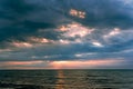 Magic sunset with dark storm clouds above the Baltic sea in Jurmala Royalty Free Stock Photo