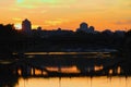 Magic sunset in Kyiv. Silhouettes of buildings and a bridge reflected in tranquil water of RusanivkaÃ¢â¬â¢s channel