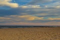 Magic sunset view seascape with beautiful colorful sky, sun and clouds. Smooth sand on the beach  white foam of ocean. Karon Royalty Free Stock Photo