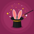 Magic top hat with rabbit ears and a wand, magician shows a trick. Entertainment party or beautiful circus show concept Royalty Free Stock Photo