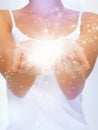 Magic twinkles on female hands Royalty Free Stock Photo