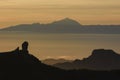 Magic view of Roque Nublo and the magestic Teide peak on the island of Tenerife in the background at sunset