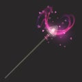 Magic wand on dark background, beautiful light effects with magical sparkle glittering texture Royalty Free Stock Photo
