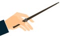 Magic wand. Hand holding a wand on a white background. Royalty Free Stock Photo