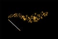 Magic wand with a stars with sparkle on black background. Trace of gold dust. Magic abstract background isolated