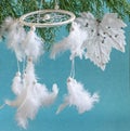 Magic wheel Dreamcatcher with feathers as interior decoration. Native american athnic heritage and amulet