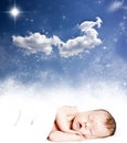 Magic winter night sky and sleeping baby