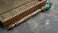 A magic wooden wand with a trapiche emerald. Royalty Free Stock Photo