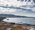 Magical arcticlandscape by Arctic Ocean in Greenland. Icebergs swimming in water. Blue sky on a summer day. Royalty Free Stock Photo