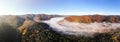 Magical beauty of the Carpathians. Morning fog spreads over the river and envelops the mountains. Amazing panoramic landscape. Aer