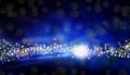 Magical blue Christmas background with bright stars and blurred lights