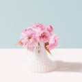 Magical cherry flowers in 3D printed net still life concept. Ultimate gray and light beige background