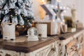 Magical Christmas snow globe with little angel statue inside. Christmas decoration around. Shallow depth of field with