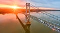 Magical golden sunrise over Hudson river bridge in New York from drone over water