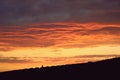 magical golden yellow and red sunset with clouds