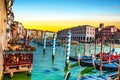 magical landscape with gondolas and boats on the Grand Canal in Venice, Italy at dawn. popular tourist attraction. Wonderful Royalty Free Stock Photo