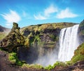 Magical landscape with silhouette of human head in front of waterfall Skogafoss in Iceland. Exotic countries. Amazing places. Royalty Free Stock Photo