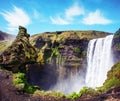 Magical landscape with silhouette of human head in front of waterfall Skogafoss in Iceland. Exotic countries. Amazing places. Royalty Free Stock Photo