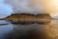 Magical landscape of Vestrahorn Mountains and Black sand dunes in Iceland at sunrise. Panoramic view of the Stokksnes headland in