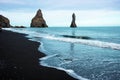 Magical majestic dramatic scenic landscape with Reynisdrangar Sea Cliffs and stones called Troll Fingers under the Reynisfjall