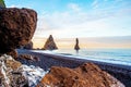 Magical majestic dramatic scenic landscape with Reynisdrangar Sea Cliffs and stones called Troll Fingers under the Reynisfjall