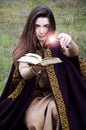 Magical manipulation with spellbook Royalty Free Stock Photo