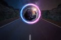 Portal on the empty highway, planet Earth behind the portal